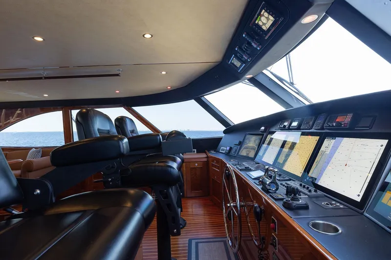Slide: The Image of Luxurious helm of 2016 Viking 82 Sky Bridge yacht with advanced navigation systems. - 30