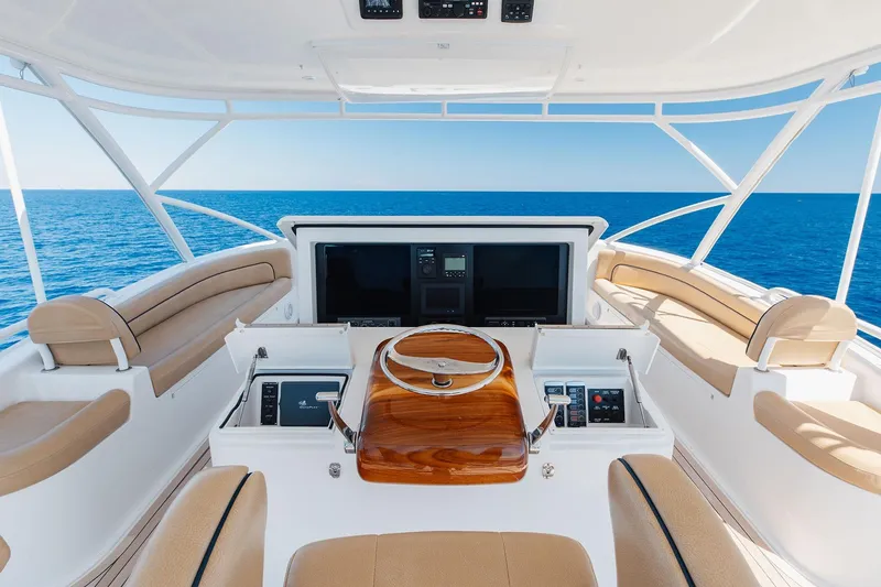 Slide: The Image of Luxurious 2016 Viking 82 Sky Bridge yacht helm with panoramic ocean view. - 9