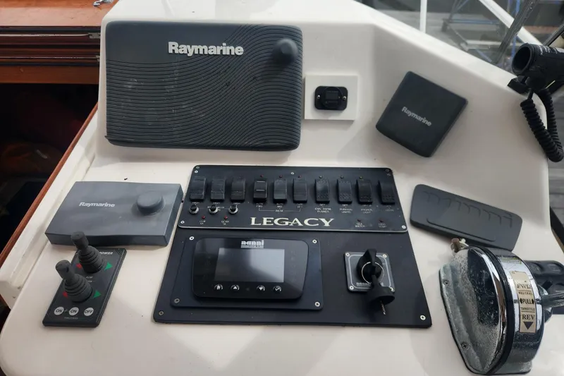 Slide: The Image of Control panel of a 2004 Legacy 28ft boat with Raymarine equipment. - 10
