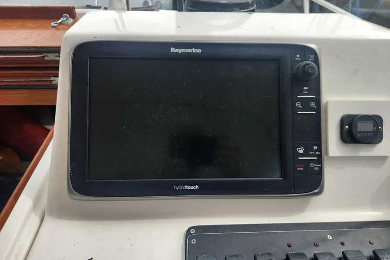 Slide: The Image of Raymarine HybridTouch display on 2004 Legacy 28ft boat dashboard. - 11