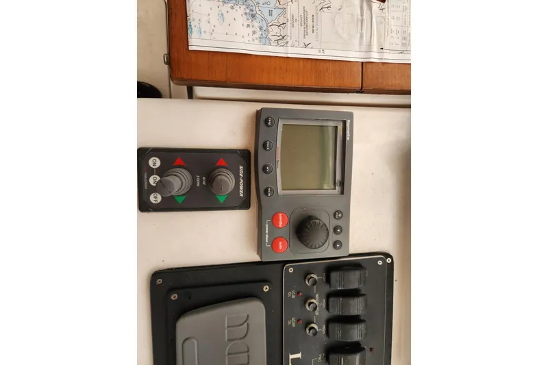 Slide: The Image of Control panel of a 2004 Legacy 28ft boat with navigation equipment. - 13