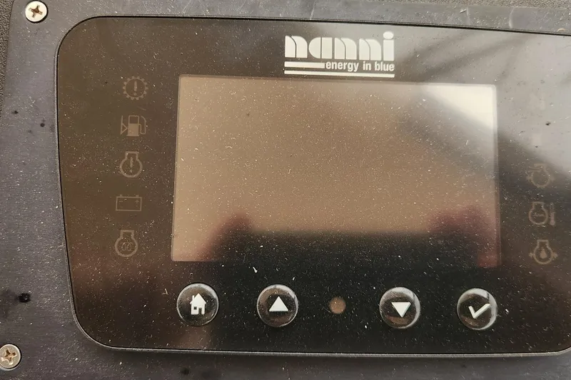 Slide: The Image of Control panel of a Nanni marine engine, featuring various function icons and buttons. - 14