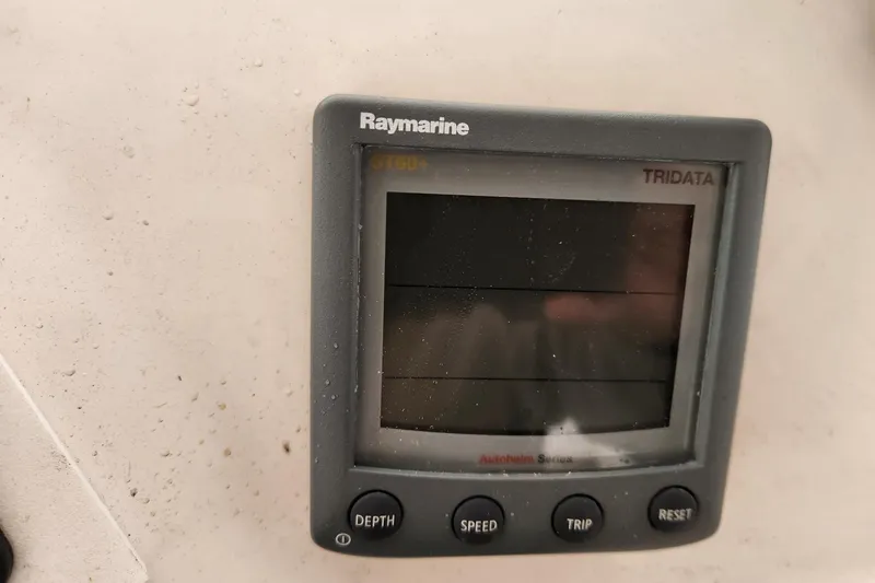 Slide: The Image of Raymarine Tridata display on 2004 Legacy 28ft boat, showing depth, speed, and trip buttons. - 15