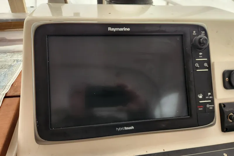 Slide: The Image of Raymarine HybridTouch display on 2004 Legacy 28ft boat dashboard. - 16