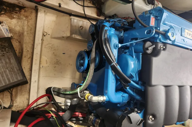 Slide: The Image of Blue engine in a 2004 Legacy 28ft boat, showing detailed components and wiring. - 47