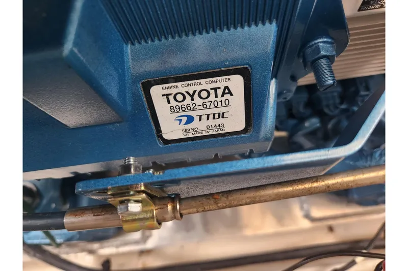 Slide: The Image of Close-up of a Toyota engine control computer in a 2004 Legacy 28ft model. - 50