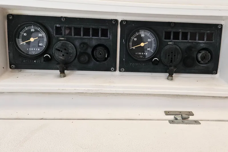Slide: The Image of Control panel of a 1996 PDQ 32 LRC boat with Yanmar gauges. - 13