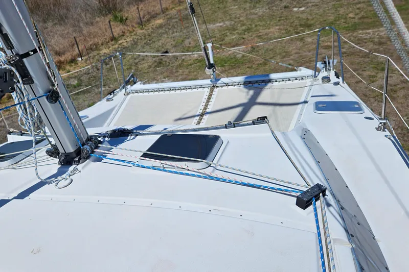 Slide: The Image of Deck view of a 1996 PDQ 32 LRC sailboat with rigging and ropes. - 15