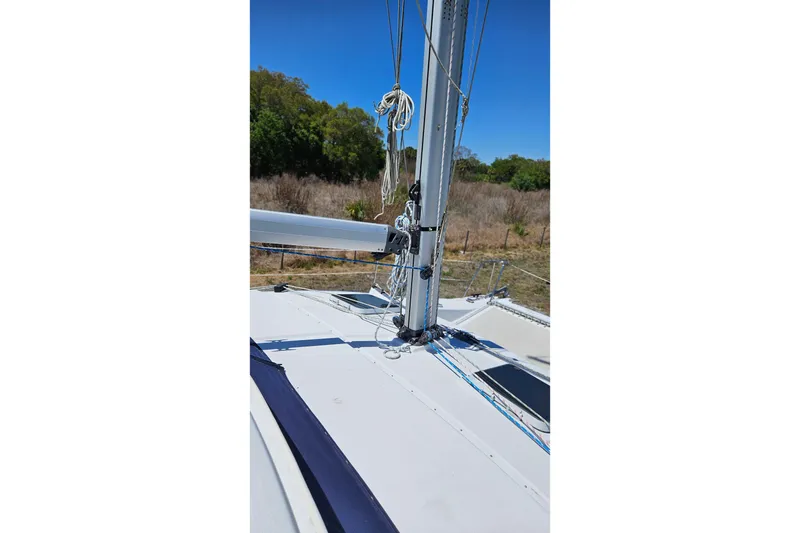 Slide: The Image of Sailboat mast and rigging on a 1996 PDQ 32 LRC under clear blue sky. - 16
