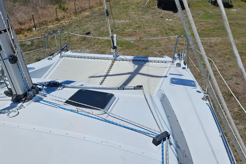 Slide: The Image of Deck view of a 1996 PDQ 32 LRC sailboat with rigging and hatch. - 18