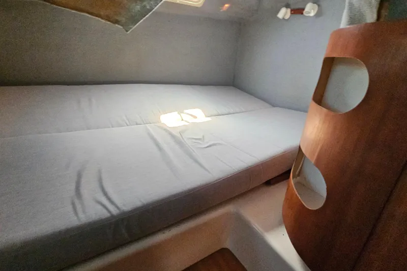 Slide: The Image of Interior cabin of 1996 PDQ 32 LRC with bed and wooden accents. - 26