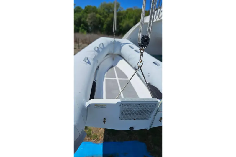 Slide: The Image of Inflatable boat suspended, featuring ropes and pulley system, PDQ 32 LRC, 1996 model. - 35