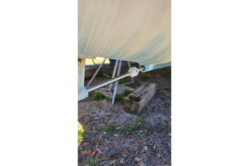 Slide: The Image of Close-up of a 1996 PDQ 32 LRC boat hull with visible metal rod. - 38