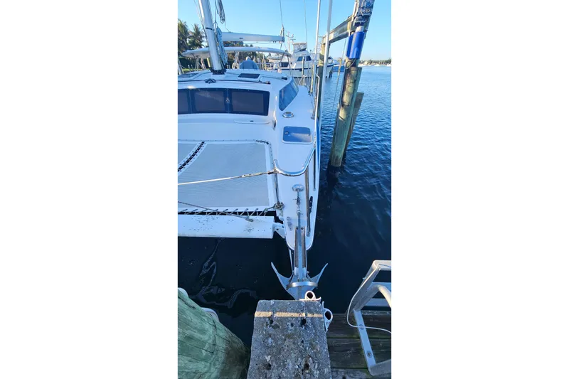 Slide: The Image of 1996 PDQ 32 LRC catamaran docked at marina, viewed from above. - 6