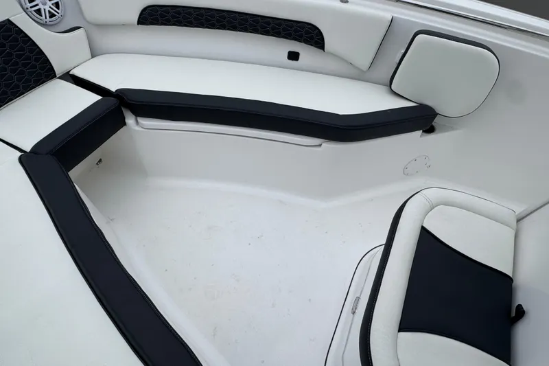 Slide: The Image of 2026 Tidewater 232 CC Adventure boat interior with cushioned seating and speaker. - 14