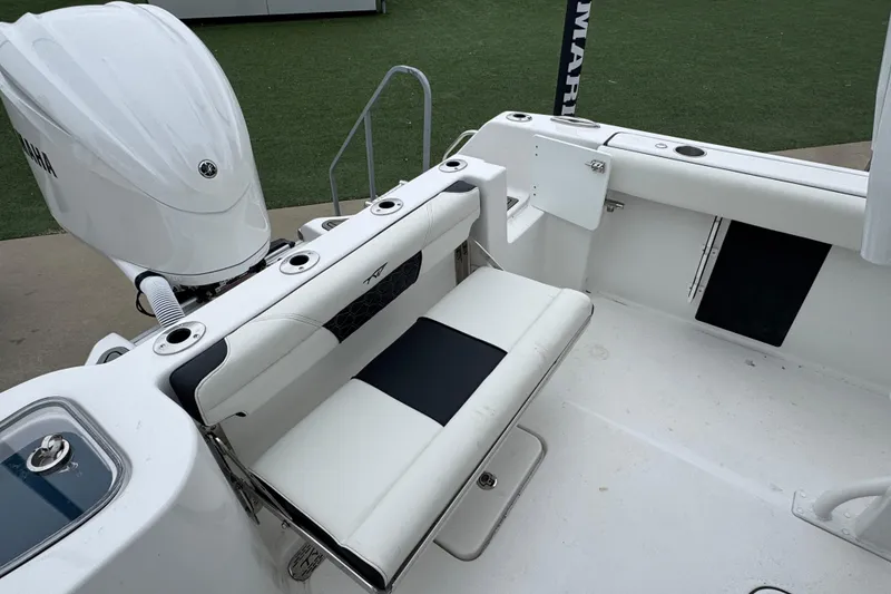 Slide: The Image of 2026 Tidewater 232 CC Adventure boat interior with Yamaha engine and seating area. - 20