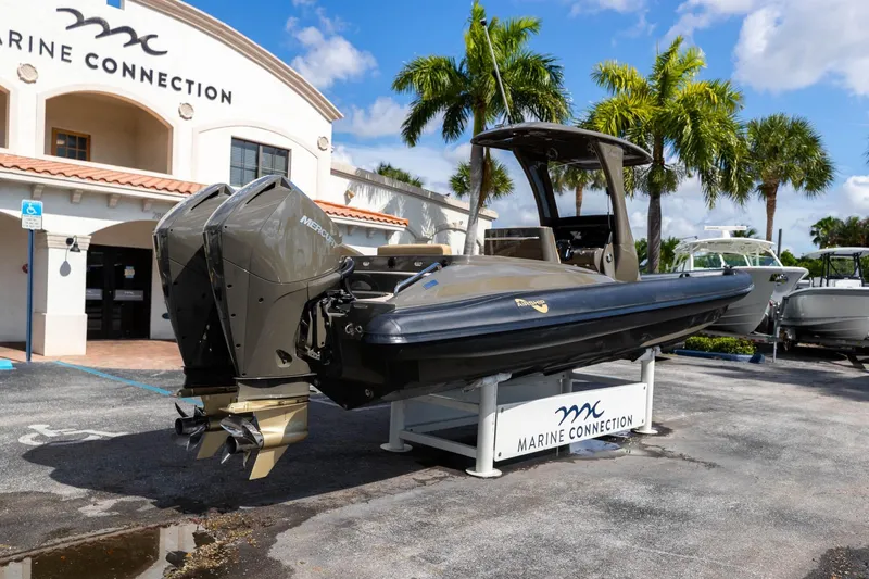 Slide: The Image of 2023 Airship 310 boat displayed at Marine Connection dealership, featuring dual Mercury engines. - 16