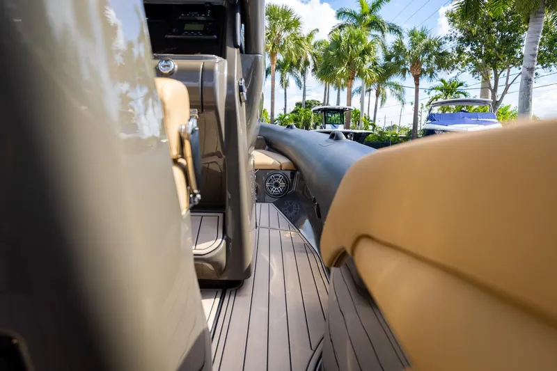 Slide: The Image of Interior view of 2023 Airship 310 boat with sleek design and luxurious seating. - 27