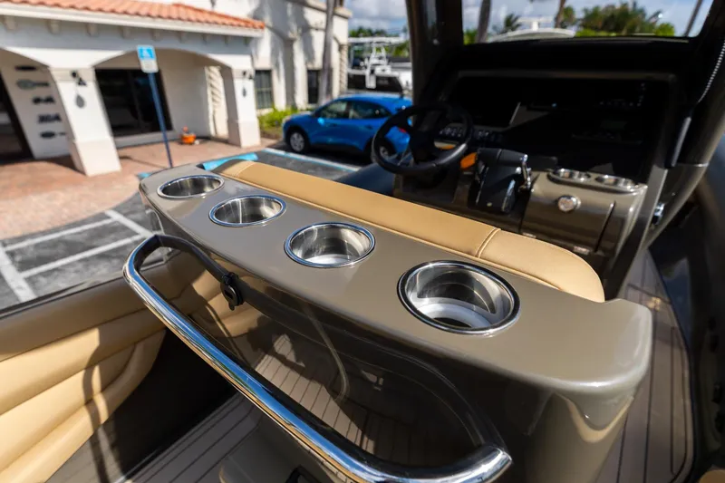 Slide: The Image of Interior of 2023 Airship 310 boat with cup holders and steering wheel. - 28