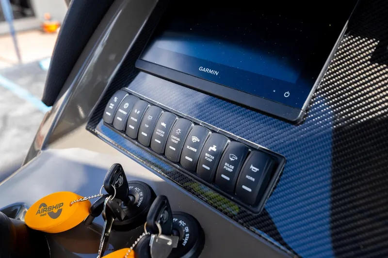 Slide: The Image of Control panel of 2023 Airship 310 with Garmin display and key switches. - 30