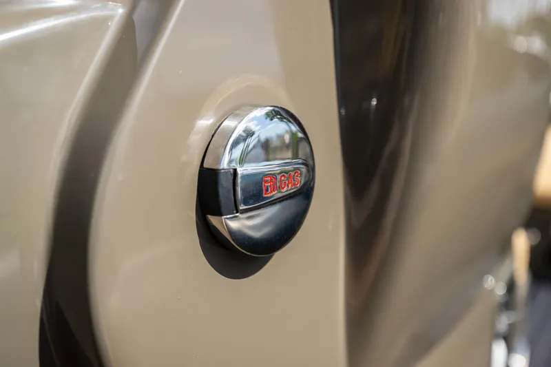 Slide: The Image of Close-up of 2023 Airship 310 gas cap with reflective chrome finish. - 33