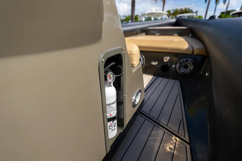 Slide: The Image of 2023 Airship 310 boat interior with fire extinguisher compartment and seating area. - 34