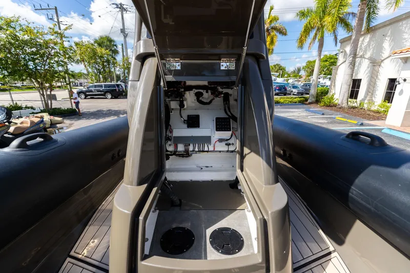 Slide: The Image of Interior view of 2023 Airship 310 boat, showcasing technical components and wiring. - 39