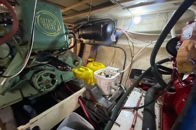 Slide: The Image of Engine room of a 1972 Chris-Craft boat featuring a Detroit Diesel engine. - 29