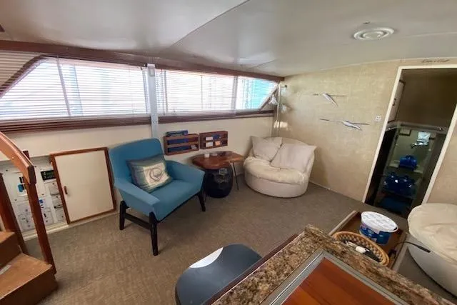 Slide: The Image of Interior of a 1972 Chris-Craft boat with cozy seating and nautical decor. - 9