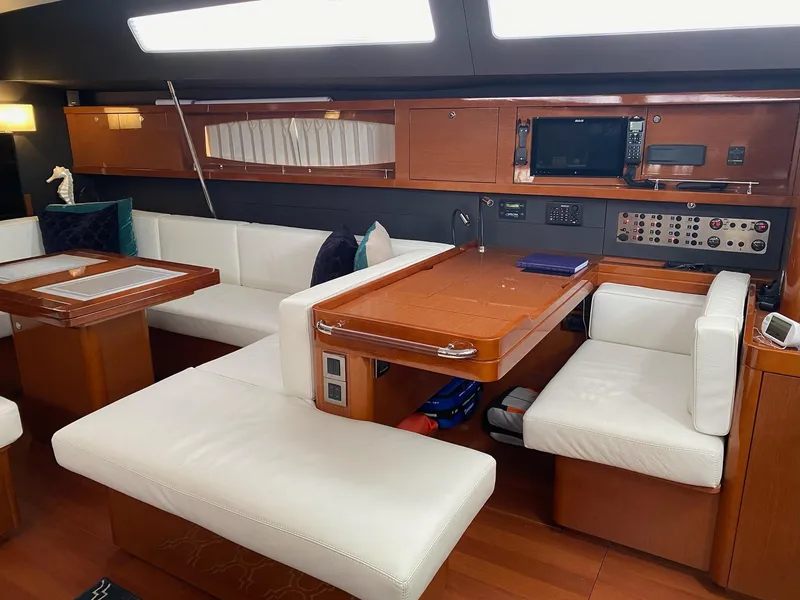 Slide: The Image of Luxurious interior of 2016 Beneteau Oceanis 60 yacht with elegant seating and navigation equipment. - 12