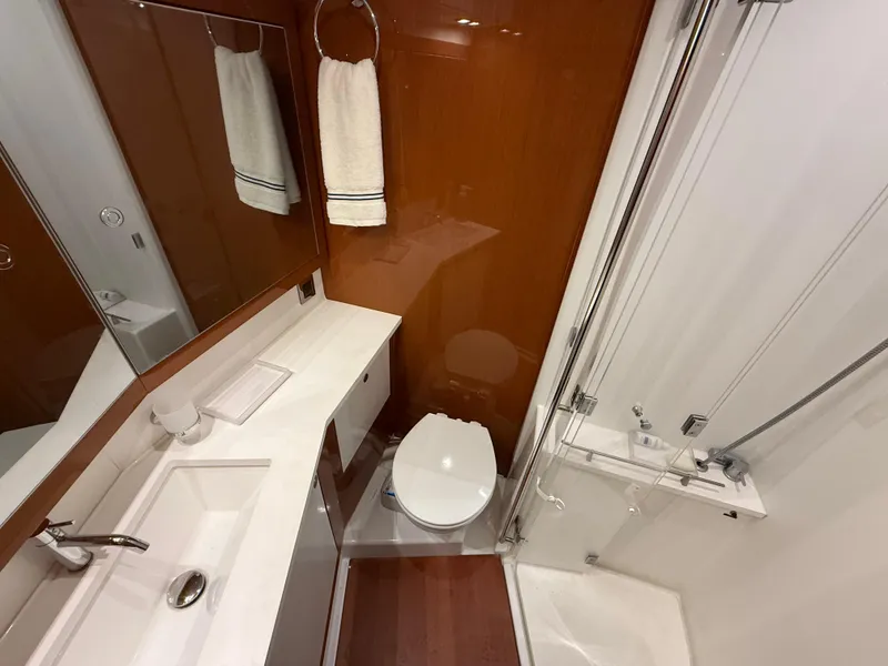 Slide: The Image of Luxurious bathroom in 2016 Beneteau Oceanis 60 yacht with modern fixtures and elegant design. - 18
