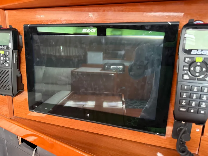 Slide: The Image of B&G navigation system on 2016 Beneteau Oceanis 60 yacht, featuring dual control panels. - 20