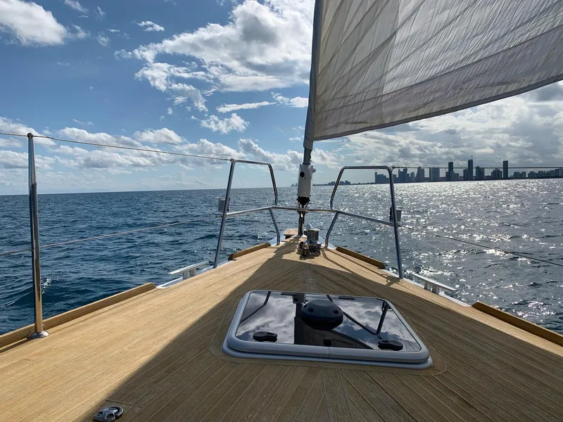 Slide: The Image of Sailing on a 2016 Beneteau Oceanis 60 yacht with city skyline in the background. - 27