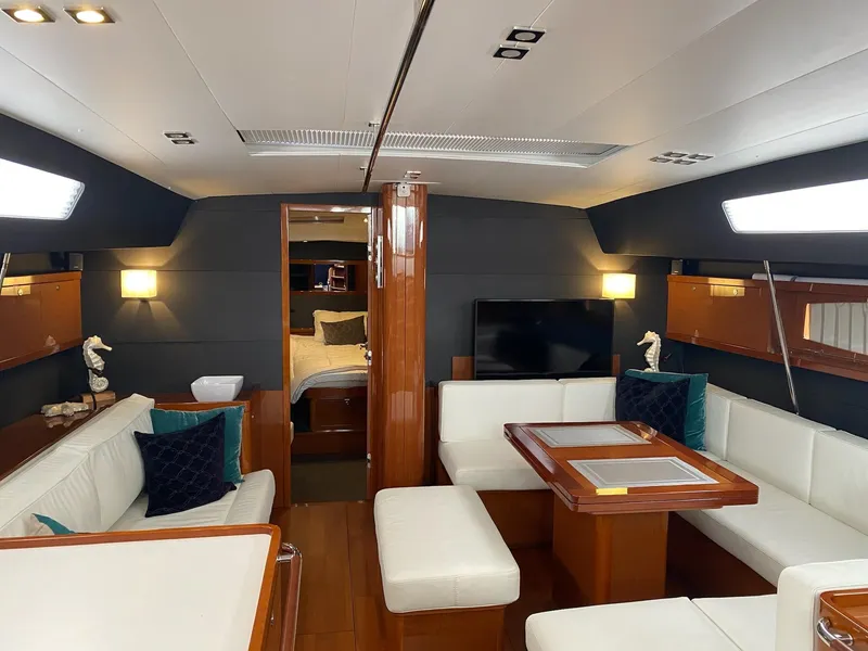 Slide: The Image of Luxurious interior of 2016 Beneteau Oceanis 60 yacht with elegant seating and modern decor. - 3