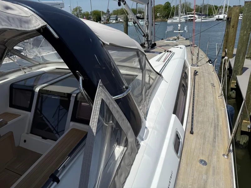 Slide: The Image of 2016 Beneteau Oceanis 60 yacht docked, showcasing sleek deck and cockpit design. - 32