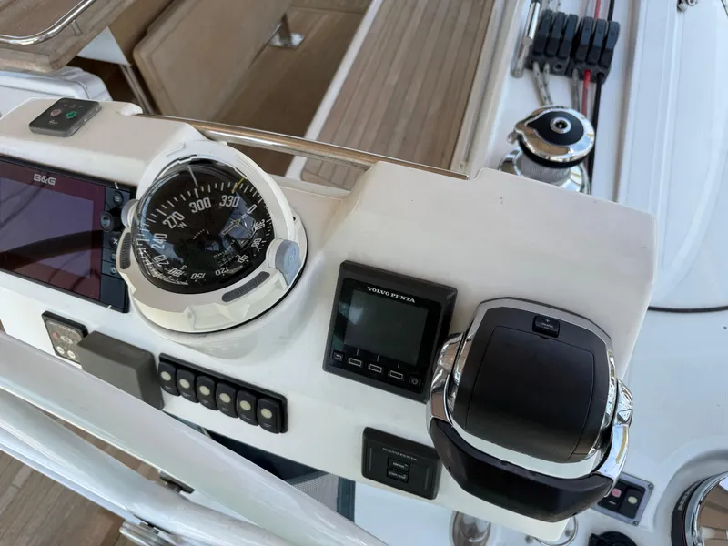 Slide: The Image of Control panel of a 2016 Beneteau Oceanis 60 sailboat with compass and navigation instruments. - 37