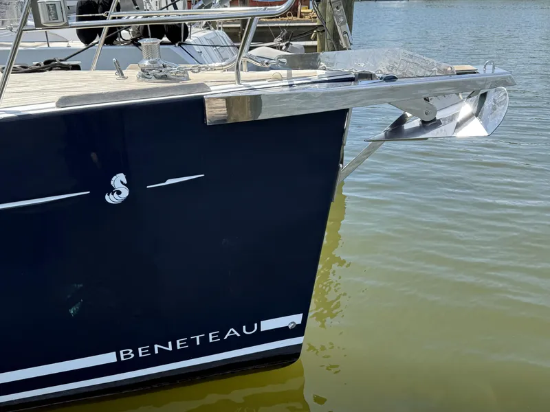 Slide: The Image of Beneteau Oceanis 60 sailboat bow, 2016 model, anchored in calm waters. - 42