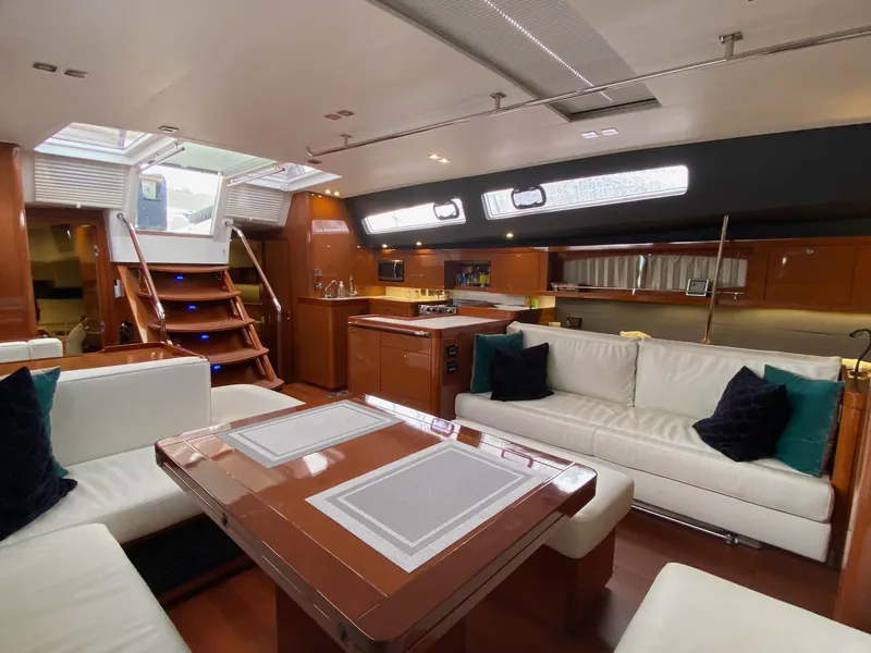 Slide: The Image of Luxurious interior of 2016 Beneteau Oceanis 60 yacht with elegant seating and modern kitchen. - 6