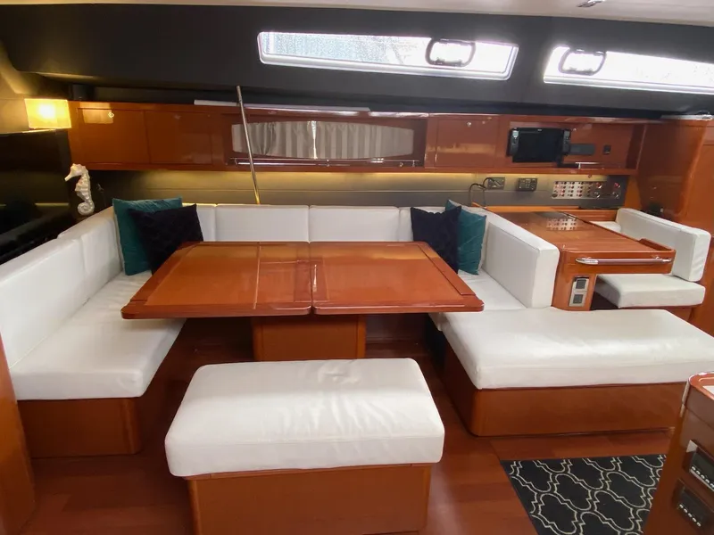 Slide: The Image of Luxurious interior of 2016 Beneteau Oceanis 60 yacht with elegant seating and dining area. - 7