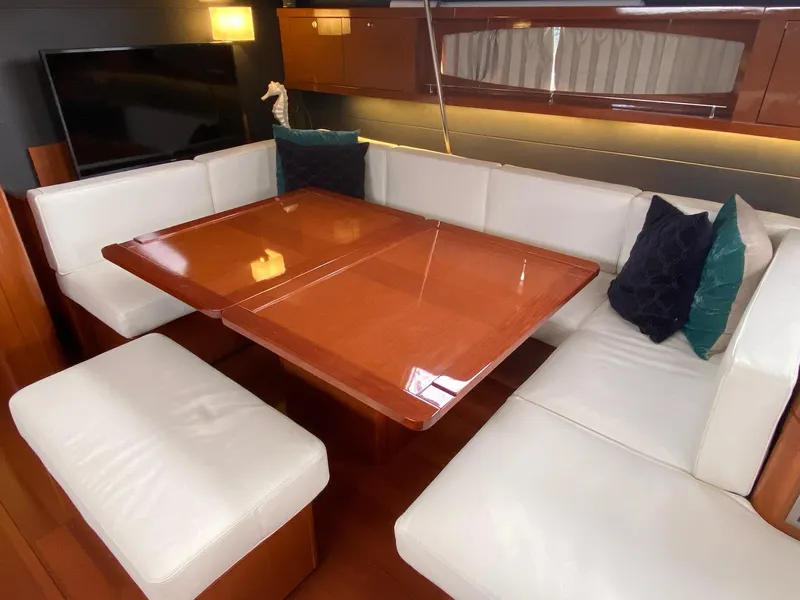 Slide: The Image of Luxurious interior of 2016 Beneteau Oceanis 60 yacht with elegant dining area. - 8