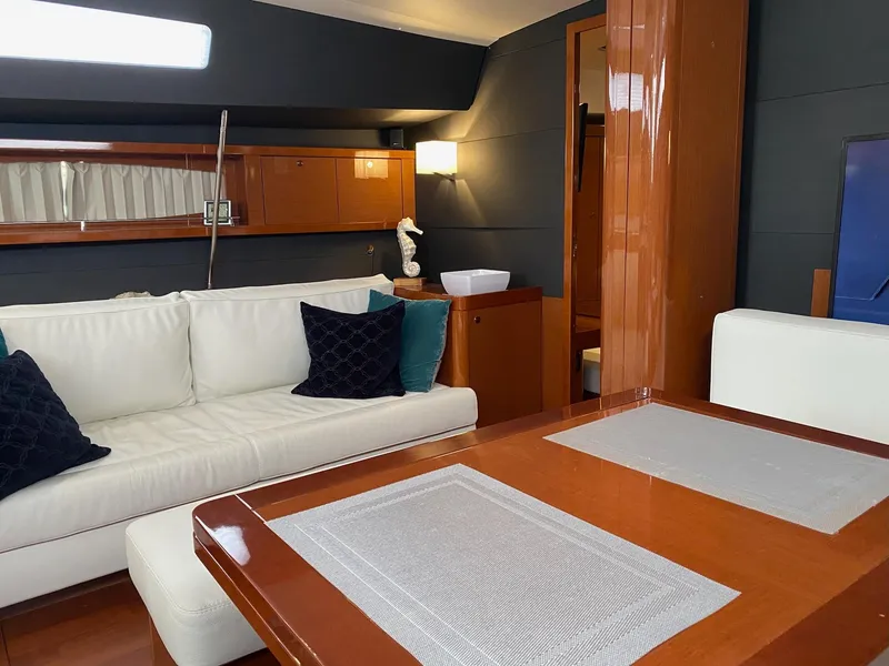 Slide: The Image of Luxurious interior of 2016 Beneteau Oceanis 60 yacht with elegant seating and wooden finishes. - 9