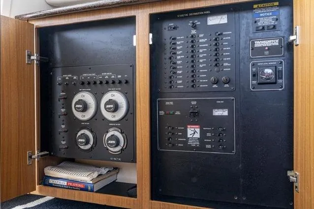 Slide: The Image of Electrical control panel inside a 2002 Bayliner 3488 Avanti boat, featuring switches and gauges. - 15