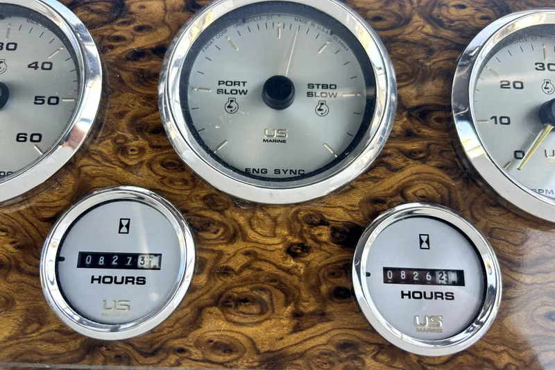 Slide: The Image of Instrument panel of a 2002 Bayliner 3488 Avanti boat with hour meters and gauges. - 24