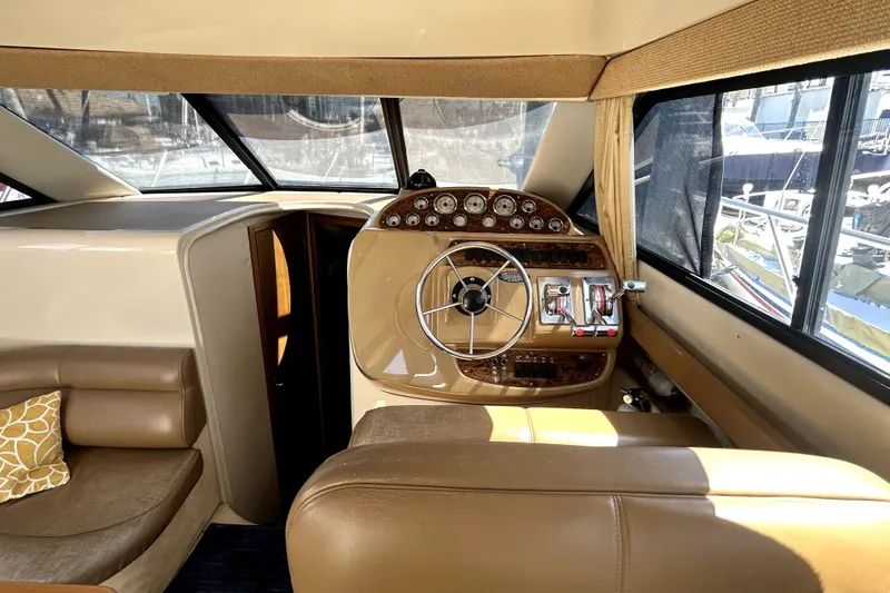 Slide: The Image of Interior helm of 2002 Bayliner 3488 Avanti yacht with steering wheel and gauges. - 30