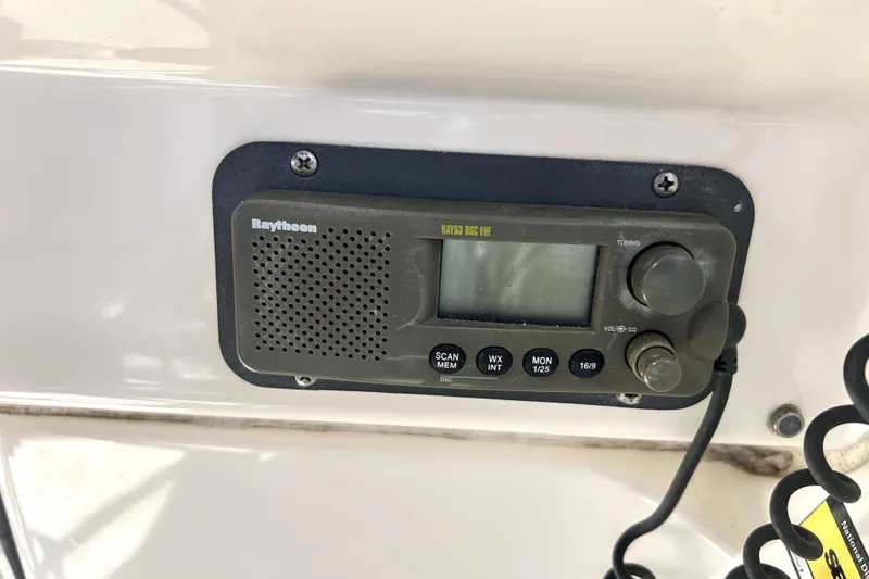 Slide: The Image of Raytheon marine radio on 2002 Bayliner 3488 Avanti boat dashboard. - 33