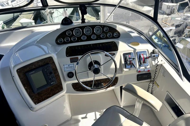 Slide: The Image of Cockpit of 2002 Bayliner 3488 Avanti with steering wheel and control panel. - 37