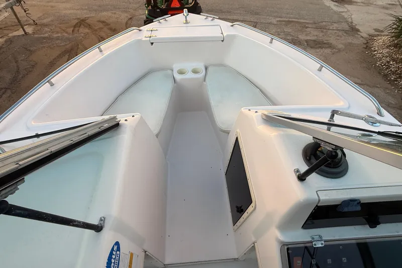 Slide: The Image of 1997 Grady-White Tournament 192 boat interior with seating and cup holders. - 16