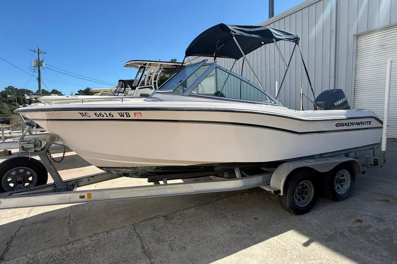 Slide: The Image of 1997 Grady-White Tournament 192 boat on trailer, parked outdoors. - 4