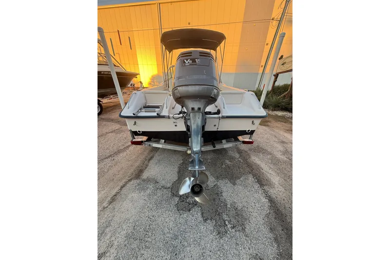 Slide: The Image of 1997 Grady-White Tournament 192 boat with V6 engine, parked on a trailer. - 9