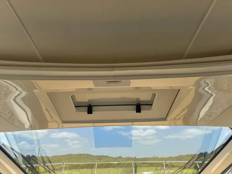 Slide: The Image of Interior view of 2017 Sea Ray Sundancer 350 Coupe's sunroof and windshield. - 12